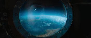 Movie still from “F9: The Fast Saga” (2021), directed by Justin Lin – A view of the earth from a space station window; Extreme Close Up shot, Overhead angle
