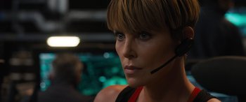 Movie still from “F9: The Fast Saga” (2021), directed by Justin Lin – A person wearing a headset; Close Up shot, Over the shoulder angle