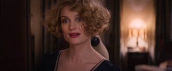 Movie still from “Fantastic Beasts and Where to Find Them” (2016), directed by David Yates – A person with curly brown hair; Close Up shot, Over the shoulder angle