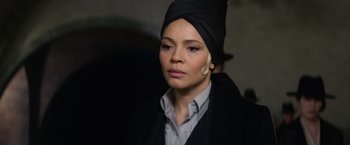 Movie still from “Fantastic Beasts and Where to Find Them” (2016), directed by David Yates – A woman with a turban on her head; Close Up shot, Over the shoulder angle