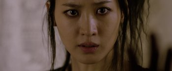 Movie still from “Fantastic Beasts: The Crimes of Grindelwald” (2018), directed by David Yates – A woman's eyes and face; Close Up shot, Over the shoulder angle