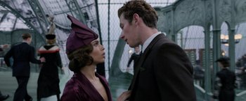 Movie still from “Fantastic Beasts: The Crimes of Grindelwald” (2018), directed by David Yates – A man and a woman standing next to each other; Close Up shot, Over the shoulder angle
