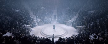 Movie still from “Fantastic Beasts: The Crimes of Grindelwald” (2018), directed by David Yates – A crowd of people sitting in front of an audience; Extreme Wide shot, High angle