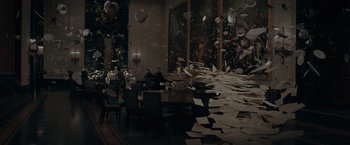 Movie still from “Fantastic Beasts: The Secrets of Dumbledore” (2022), directed by David Yates – A room filled with lots of papers flying in the air; Extreme Wide shot, High angle