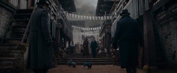 Movie still from “Fantastic Beasts: The Secrets of Dumbledore” (2022), directed by David Yates – Two people are walking down the steps of a building; Wide shot, High angle