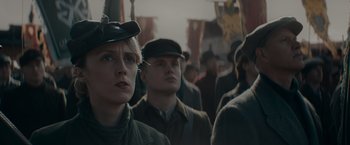 Movie still from “Fantastic Beasts: The Secrets of Dumbledore” (2022), directed by David Yates – A group of people standing next to each other; Close Up shot, Low angle