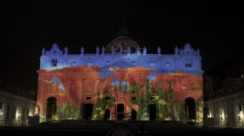 Movie still from “Fantastic Fungi” (2019), directed by Louie Schwartzberg – A building that is lit up at night; Extreme Wide shot, Low angle