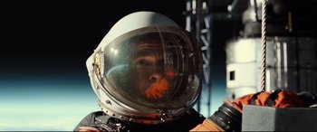 Movie still from “Ad Astra” (2019), directed by James Gray – A man wearing a space suit and helmet; Close Up shot, Overhead angle
