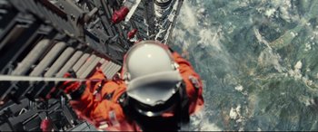 Movie still from “Ad Astra” (2019), directed by James Gray – A person in a spacesuit is looking down at the ground; Extreme Wide shot, Overhead angle
