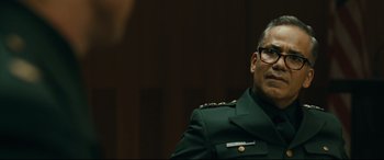 Movie still from “Ad Astra” (2019), directed by James Gray – A person wearing a military uniform; Close Up shot, Over the shoulder angle