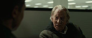 Movie still from “Ad Astra” (2019), directed by James Gray – An old man with white hair sitting in front of a window; Close Up shot, Over the shoulder angle