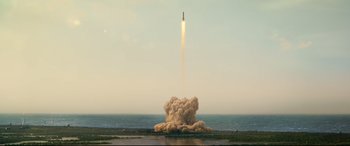 Movie still from “Ad Astra” (2019), directed by James Gray – A rocket launching into the sky from the ocean; Extreme Wide shot, Low angle
