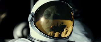 Movie still from “Ad Astra” (2019), directed by James Gray – An old man wearing a space helmet looking into a mirror; Close Up shot, Overhead angle