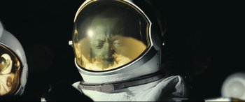 Movie still from “Ad Astra” (2019), directed by James Gray – A man wearing a space suit with a reflection of himself; Close Up shot, Overhead angle