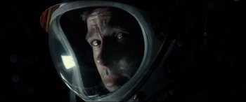 Movie still from “Ad Astra” (2019), directed by James Gray – A person wearing a space helmet; Close Up shot, Overhead angle