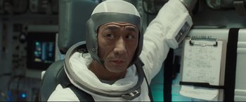 Movie still from “Ad Astra” (2019), directed by James Gray – A man in a spacesuit and a helmet; Close Up shot, Low angle