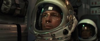 Movie still from “Ad Astra” (2019), directed by James Gray – A person wearing a space helmet; Close Up shot, Overhead angle