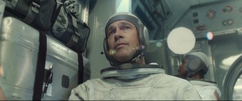 Movie still from “Ad Astra” (2019), directed by James Gray – A person wearing a space suit; Close Up shot, Overhead angle