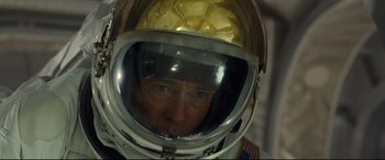 Movie still from “Ad Astra” (2019), directed by James Gray – A person wearing a space suit; Close Up shot, Overhead angle