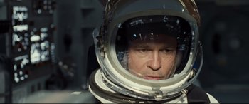 Movie still from “Ad Astra” (2019), directed by James Gray – A person wearing a space suit; Close Up shot, Overhead angle
