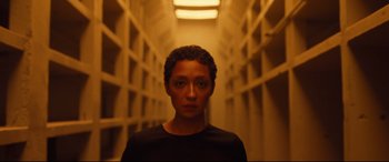 Movie still from “Ad Astra” (2019), directed by James Gray – A man standing in a hallway of a jail cell; Close Up shot, Low angle