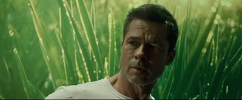 Movie still from “Ad Astra” (2019), directed by James Gray – A person wearing a white t - shirt; Close Up shot, Low angle