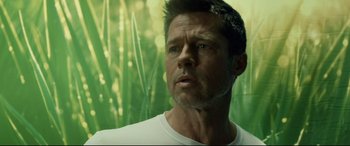 Movie still from “Ad Astra” (2019), directed by James Gray – A person wearing a white t - shirt; Close Up shot, Low angle