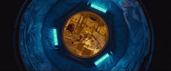 Movie still from “Ad Astra” (2019), directed by James Gray – An overhead view of a person in a space suit; Wide shot, Overhead angle