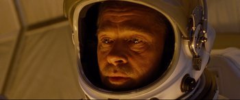 Movie still from “Ad Astra” (2019), directed by James Gray – A person wearing a space suit; Close Up shot, Overhead angle