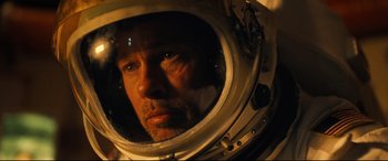 Movie still from “Ad Astra” (2019), directed by James Gray – A person in a space helmet; Close Up shot, Overhead angle