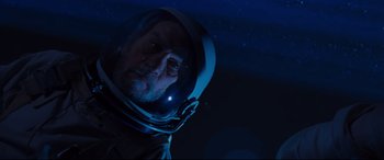 Movie still from “Ad Astra” (2019), directed by James Gray – A man wearing a space suit and a helmet; Close Up shot, Low angle