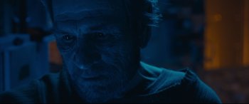 Movie still from “Ad Astra” (2019), directed by James Gray – A man's face in the dark; Close Up shot, Low angle