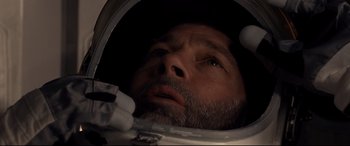 Movie still from “Ad Astra” (2019), directed by James Gray – A person in a space suit; Close Up shot, Overhead angle