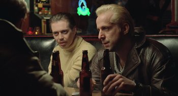 Movie still from “Fargo” (1996), directed by Ethan Coen – A couple of men sitting at a table with some beer; Close Up shot, Low angle