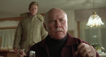 Movie still from “Fargo” (1996), directed by Ethan Coen – An older man in a brown jacket and a younger man in a brown jacket; Close Up shot, Low angle
