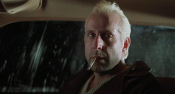 Movie still from “Fargo” (1996), directed by Ethan Coen – A person smoking a cigarette; Close Up shot, Low angle