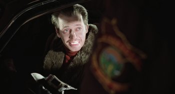 Movie still from “Fargo” (1996), directed by Ethan Coen – A man in a fur coat looking into a mirror; Close Up shot, Low angle