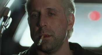 Movie still from “Fargo” (1996), directed by Ethan Coen – A person smoking a cigarette; Close Up shot, Low angle