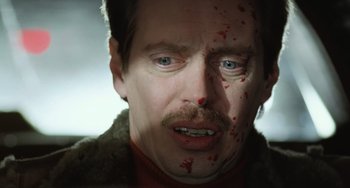 Movie still from “Fargo” (1996), directed by Ethan Coen – A person with blood all over his face; Close Up shot, Low angle