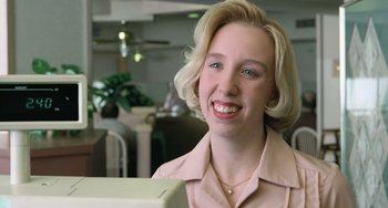 Movie still from “Fargo” (1996), directed by Ethan Coen – A woman with blonde hair smiles at the camera; Close Up shot, Low angle