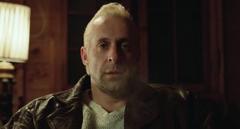 Movie still from “Fargo” (1996), directed by Ethan Coen – A person wearing a leather jacket; Close Up shot, Low angle