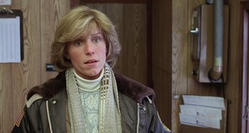 Movie still from “Fargo” (1996), directed by Ethan Coen – A woman in a brown jacket and a white sweater; Close Up shot, Over the shoulder angle