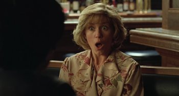 Movie still from “Fargo” (1996), directed by Ethan Coen – A woman with her mouth wide open looking surprised; Close Up shot, Over the shoulder angle