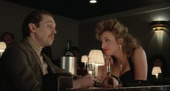 Movie still from “Fargo” (1996), directed by Ethan Coen – A man and a woman sitting at a table with a glass of wine; Close Up shot, Low angle