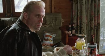 Movie still from “Fargo” (1996), directed by Ethan Coen – A man sitting at a table with a bowl of food; Close Up shot, Low angle