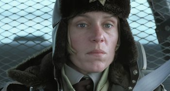 Movie still from “Fargo” (1996), directed by Ethan Coen – A person wearing a uniform and a hat; Close Up shot, Low angle