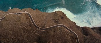 Movie still from “Fast & Furious 6” (2013), directed by Justin Lin – An aerial view of a road going down a cliff; Extreme Wide shot, High angle