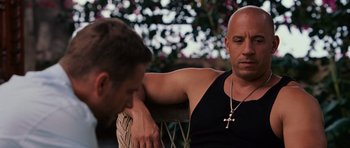 Movie still from “Fast & Furious 6” (2013), directed by Justin Lin – A man sitting next to another man on a park bench; Close Up shot, Over the shoulder angle