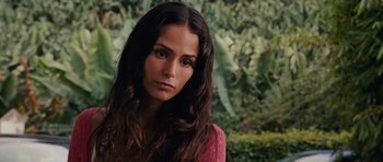 Movie still from “Fast & Furious 6” (2013), directed by Justin Lin – A beautiful woman with long brown wavy hair; Close Up shot, Over the shoulder angle