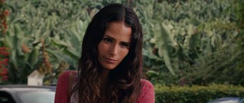 Movie still from “Fast & Furious 6” (2013), directed by Justin Lin – A beautiful woman with long brown hair wearing a pink shirt; Close Up shot, Over the shoulder angle